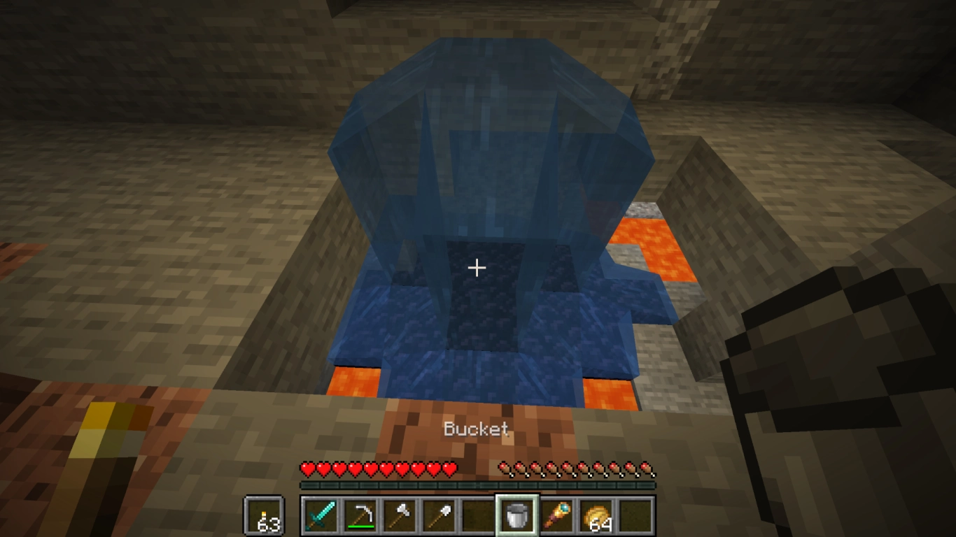 Emmer met water om valschade te vermijden en lava in obsidiaan te veranderen in Minecraft